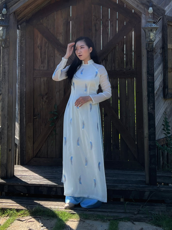 Custom Ao Dai featuring stunning sheer fabric over white chiffon