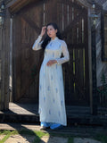 Custom Ao Dai featuring stunning sheer fabric over white chiffon