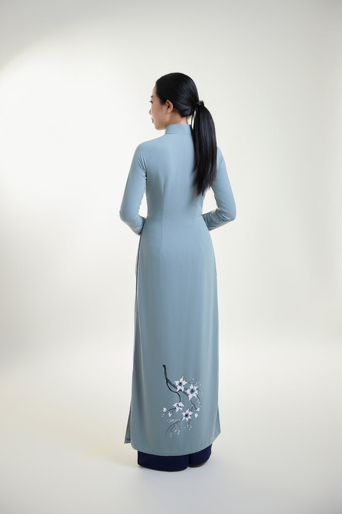 Back view of grey silk Ao Dai with subtle floral hand-painted design.