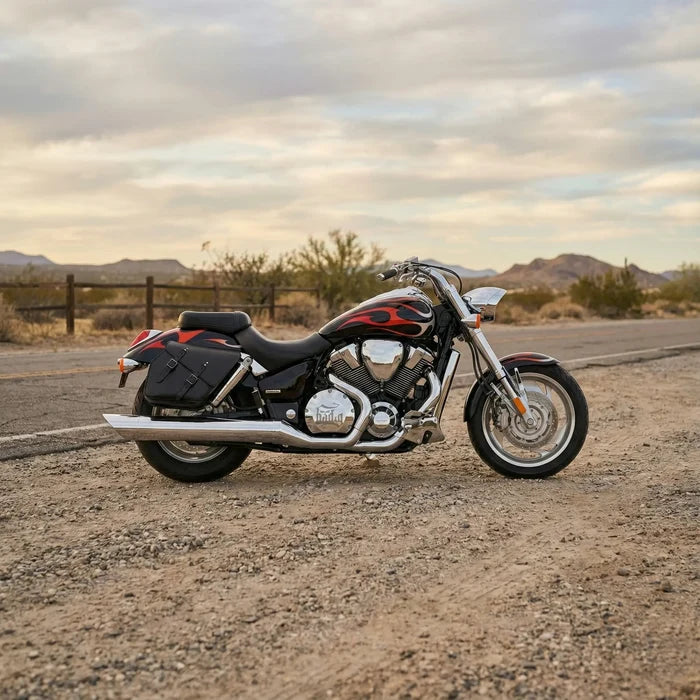 Honda VTX motorcycle parked on a desert road with mountains in the background