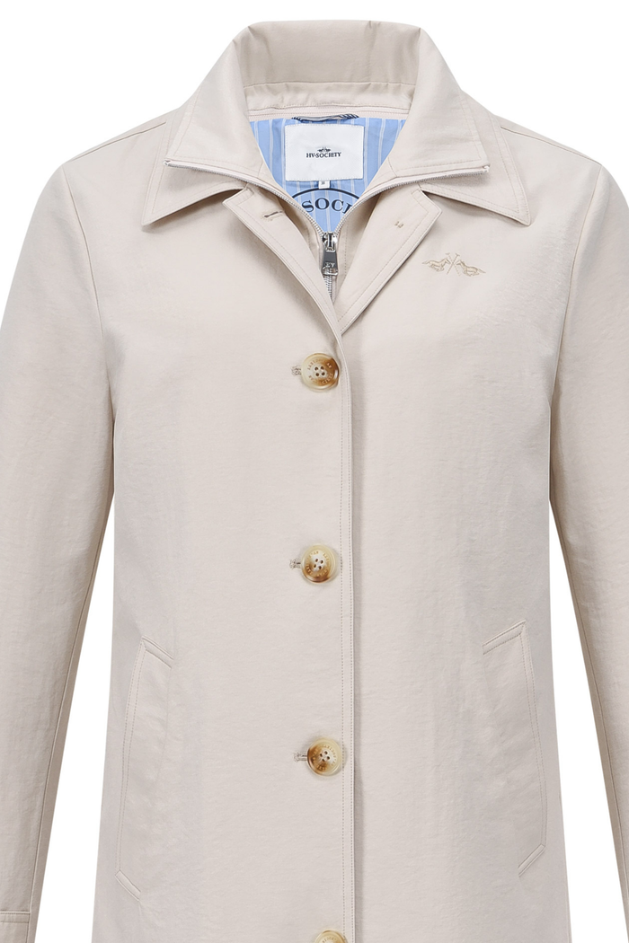 HV Society Piper trench coat in kit with a classic tailored fit and smart button front. A timeless lightweight coat for everyday wear. Shop at Dotique.