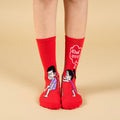 Red socks with cartoon characters and text on a beige background-Khol Darwaza- Character Edition-