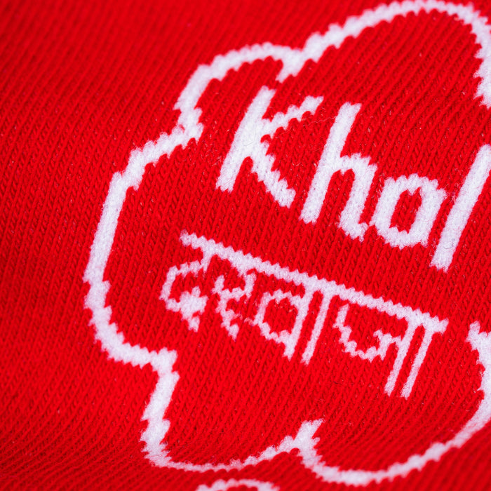 Red fabric with white text and design, including the word 'Khol' and additional characters.-Khol Darwaza- Character Edition-