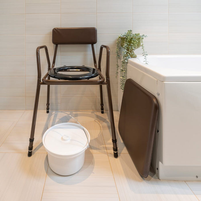 NRS Dovedale Adjustable Commode with Detachable Arms with lid closed, highlighting the padded seat and discreet design.