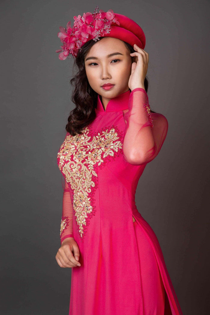 Mark&Vy Ao Dai Wedding ao dai with long train. Pink fabric with gold colored details.