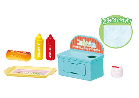 Sumikogurashi Burger Shop Re-ment Blind Box Series featuring a toy set with eight unique burger-themed designs in a blue toy box.