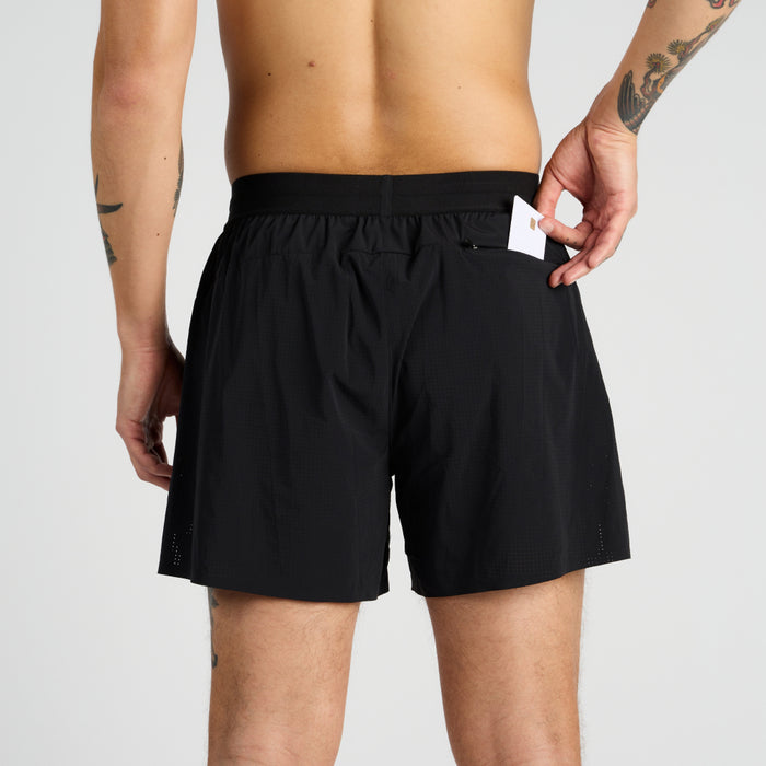 Back view of the Vento™ 5" Men's Training Short, featuring a custom wasitband with a hand shown putting a credit card into the back zipper pocket.