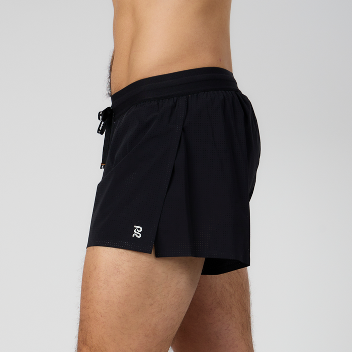Side view of the Vento™ 3" Split Short, featuring a reflective logo, custom waistband with branded drawstring, and a bonded split in the fabric.