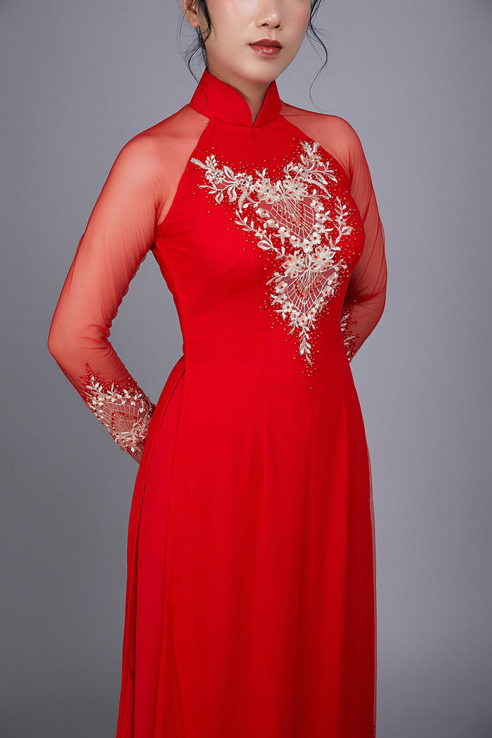 Wedding ao dai in red chiffon fabric. Features beautiful hand beading.