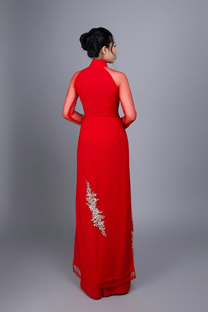 Wedding ao dai in red chiffon fabric. Features beautiful hand beading.