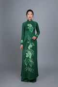Women's ao dai dress Vietnamese traditional long dress. High quality green colored fabric with embroidered, lotus motif.